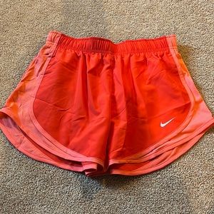 Red and pink Nike shorts